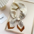 Artistic square silk scarf with figure print and brown borders on display tray - Architectural Line Beige