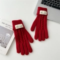 Detail of red cable knit gloves with touch screen design and warm thermal fabric - Burgundy