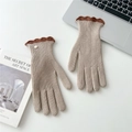 Detail of beige knit gloves with dark brown scalloped cuffs and a decorative gold button - Coffee Contrast Scalloped Edge