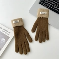 Detailed shot of two-tone knit gloves featuring brown wool and beige fleece cuffs - One Size / Brown