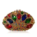 Detail of luxury evening clutch featuring colorful crystals and marquise gemstones - Gold Red