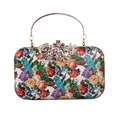 Detailed view of floral dinner clutch with gold metal handle and rhinestone flower clasp - White