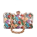 Macro shot of 3D gold flower clasp on a white floral print clutch bag with gold chain - White