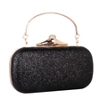 Dettaglio pochette da sera con paillettes nere, chiusura di strass e manico dorato - Nero