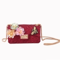 Detail of red embossed rose bag with iridescent flowers, gold bee, and chain strap - Burgundy