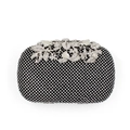Close-up of elegant silver leaf clasp with inlaid diamonds on black crystal evening clutch - Black