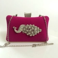 Detail of rose red velvet evening clutch featuring a sparkling rhinestone peacock motif - Rose Red
