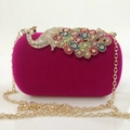 Detailed macro view of magenta velvet evening clutch with multicolored peacock rhinestone inlay - Rose Red (Colorful Diamonds)