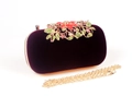 Detailed close-up of velvet evening clutch with luxury crystal floral leaf decoration - Burgundy