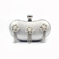 Detail of silver evening clutch with silk texture, pearl flowers and rhinestone tassels - Silver