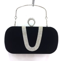 Detail of black velvet evening clutch featuring U-shaped rhinestone bands and ring buckle - Black