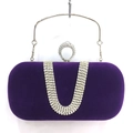 Detail of purple velvet evening clutch with U-shaped rhinestone pattern and ring closure - Purple