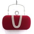 Detailed view of red velvet evening clutch featuring U-shaped rhinestone tassel fringe - Red