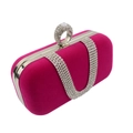 Macro detail of deep pink velvet evening clutch featuring a crystal ring handle and silver frame - Rose Red