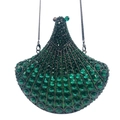 Detailed macro view of deep green rhinestone fan-shaped evening clutch bag - Green