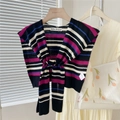 Detail of multi-color striped knitted shawl with knotted front on a wooden hanger - 44X100CM / Striped Black
