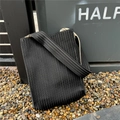 Detail of black and white striped pleated knit tote bag with vertical textured fabric - Black