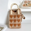Detailed texture of knitted mini crossbody bag with caramel heart patterns and handle - 11*25cm / Beige With Caramel Heart