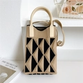 Detail of a mini knitted handbag with khaki and black triangle pattern and soft silicone handle - Camel and Black Triangle