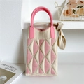 Detailed close-up of pink and beige geometric knit handbag with soft silicone handle - Pink and Beige Triangle