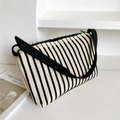 Close-up of the vertical black and white striped texture on this knitted shoulder bag - 25*20cm / Black