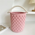 Detailed texture of pink knitted bucket bag featuring 3D puff balls and pearl handles - 20cm x 20cm x 15cm / Light Pink