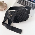 Close-up of black popcorn texture knit bag with gold zipper and adjustable wide strap - Black