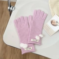 Detail of pink knitted gloves with white pom-pom decor and soft wool blend texture - One Size / Purple