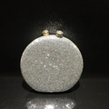 Sparkling silver crystal evening bag with golden spherical clasps on a black background - Silver