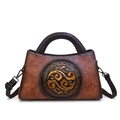 Vintage caramel brown embossed leather handbag with traditional Chinese relief pattern - Yellow