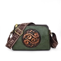 Vintage green crossbody bag with floral embossed pattern and wide branded textile strap - Green