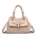 Beige bow-style tote bag with pleated leather design and gold hardware on white background - Apricot