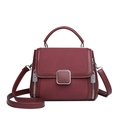 Elegant burgundy leather handbag for women featuring silver buckle and top handle - Red