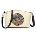 Beige leather shoulder bag featuring an embossed lotus pattern and dark brown straps - Off White