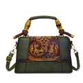 Retro dark green shoulder bag with bamboo handle and embossed floral flap details - Green