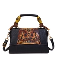 Vintage black crossbody bag with caramel floral embossing and unique bamboo handle - Black