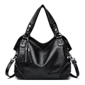 Black wax leather tote bag with elegant tassels and adjustable shoulder strap - Black
