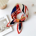 Pleated silk scarf with geometric red blue patterns tied in a stylish bow knot - Semicircle Leaf Red Border