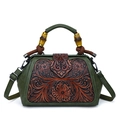 Vintage green leather handbag with floral relief pattern and bamboo wood handle detail - Green