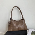 Dark brown woven shoulder bag with intricate leather texture and vintage aesthetic - Tan