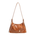 Caramel brown gloss shoulder bag with top zipper and metal pendant on white background - Brown