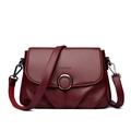 Burgundy textured leather crossbody bag with silver ring buckle and adjustable strap - Red