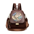 Brown leather ethnic backpack with colorful elephant relief and woven strap for women - Brown