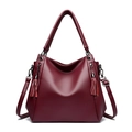 Large burgundy leather tote bag with stylish long tassels and adjustable shoulder strap - Burgundy