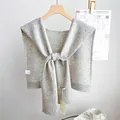 Detail of light gray wool knit shawl with ribbed edges and elegant front tie closure - 46x115cm / Light Gray