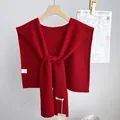 Detail of 100% wool knit shawl showing premium thick texture and washing label - 46x115cm / Red