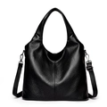 Minimalist black pebble leather tote bag with adjustable strap for shoulder or crossbody use - Black