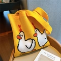 Close-up of a yellow knitted tote bag featuring cute cartoon white duck patterns - Bright Yellow (Little Yellow Duck)
