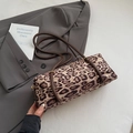 Chic leopard print cylindrical shoulder bag with dark brown handles and gold hardware - Khaki