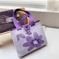 Detail view of purple floral knit tote bag showing the wide strap and snap button closure - 22*28cm / Purple Tri-Color Flower
